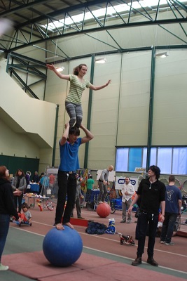 two person stack on a walking globe in the practice hall, photo courtesy of Rainbow Making